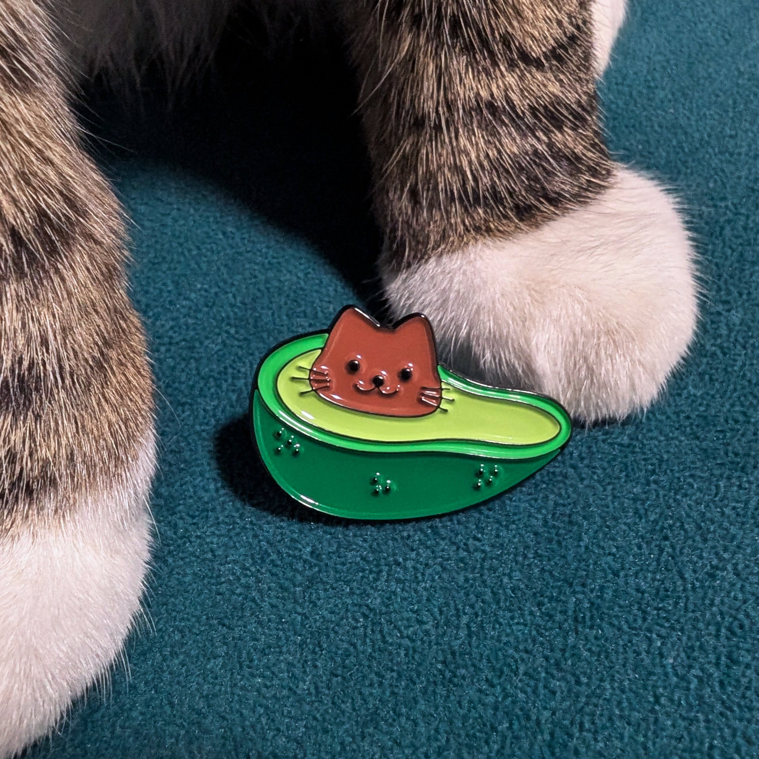 Half an avocado enamel pin with a cat-shaped pit — cute foodie cat gift