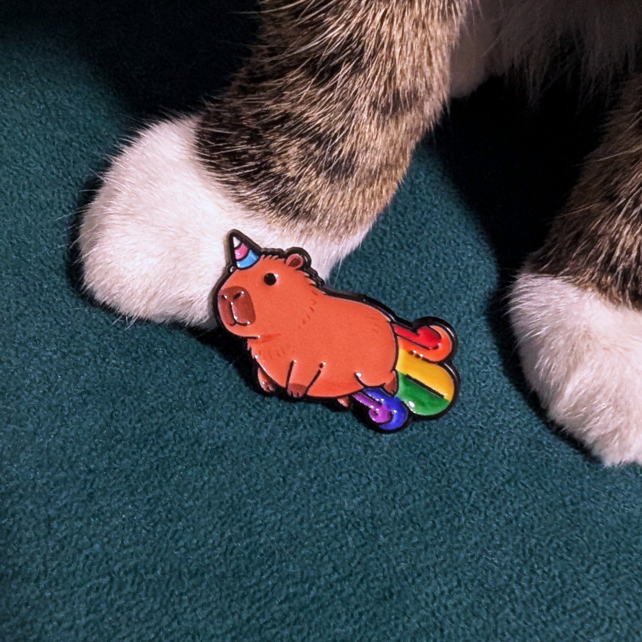Capybara unicorn enamel pin with rainbow trail