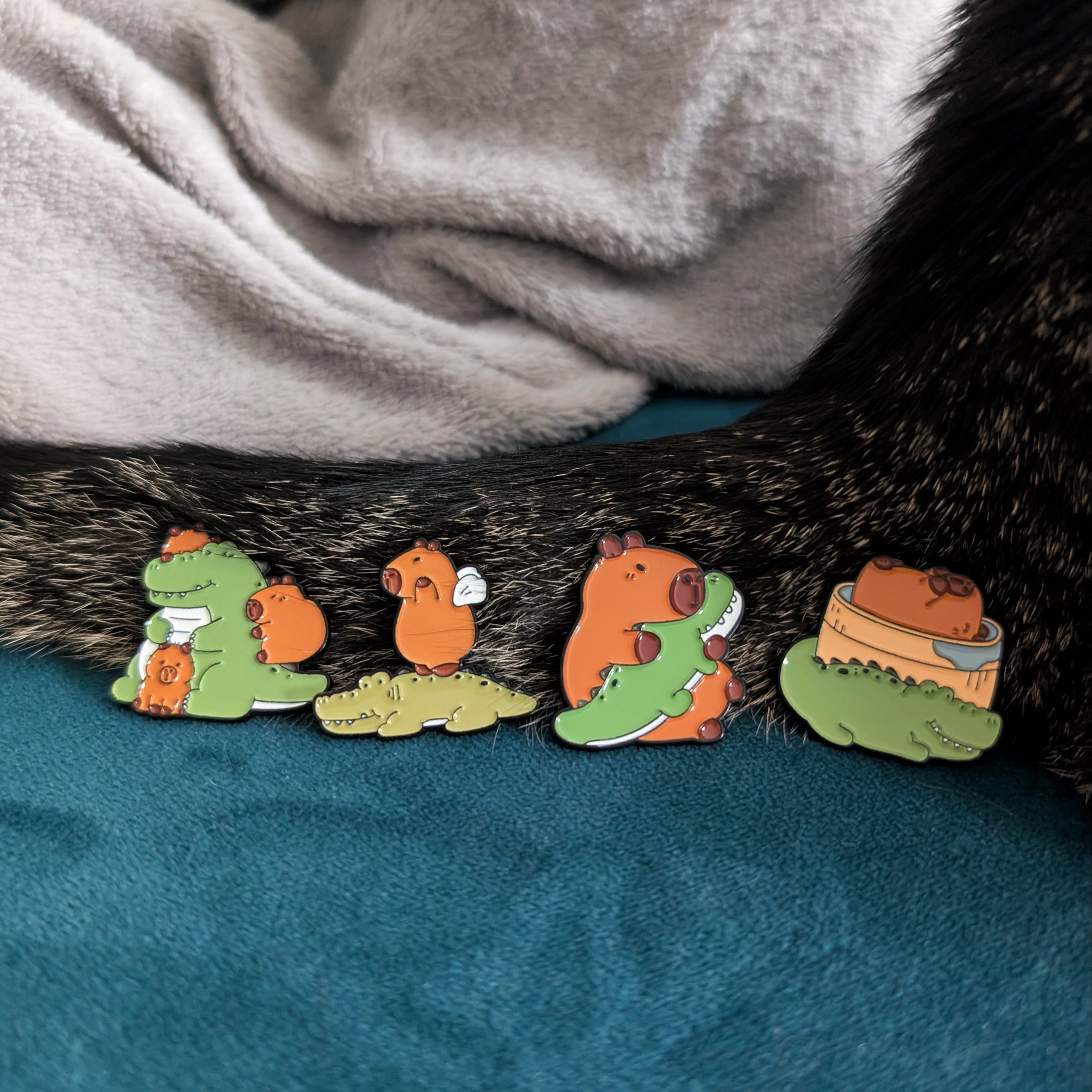 Capybaras and crocodiles pins