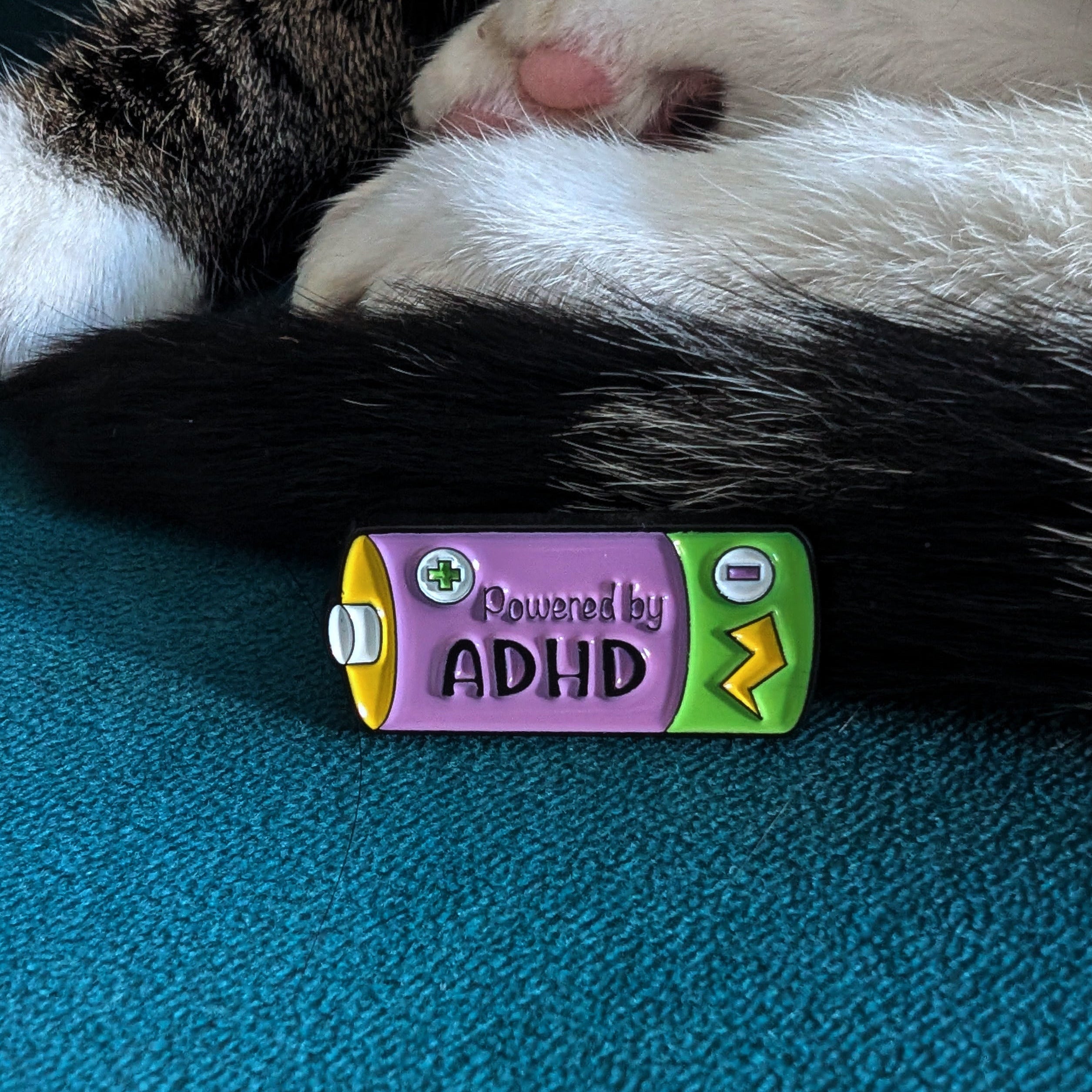 Powered By ADHD battery enamel pin — neurodivergent gift